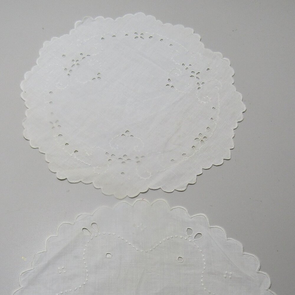 2 white round embroidered cut work doilies 8 inches coordinating similar design